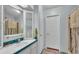 Well-lit bathroom with a shower and vanity, providing functionality and comfort at 6509 Oak Hammock Ct, Winter Haven, FL 33884