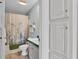 Bright bathroom features a combination shower and tub and tiled flooring at 6509 Oak Hammock Ct, Winter Haven, FL 33884