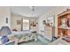 Cozy bedroom features a ceiling fan, natural light, and decorative wall hangings at 6509 Oak Hammock Ct, Winter Haven, FL 33884