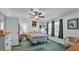 Cozy bedroom with a ceiling fan, natural light, and comfortable furnishings at 6509 Oak Hammock Ct, Winter Haven, FL 33884