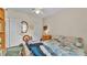 Bedroom featuring a double bed, side tables, and ample storage at 6509 Oak Hammock Ct, Winter Haven, FL 33884