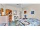 Comfortable bedroom featuring neutral walls, ceiling fan and ample storage at 6509 Oak Hammock Ct, Winter Haven, FL 33884