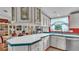 Bright kitchen featuring a breakfast bar with seating and modern appliances at 6509 Oak Hammock Ct, Winter Haven, FL 33884