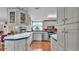 The kitchen is bright and spacious, offering ample storage, tile countertops and modern appliances at 6509 Oak Hammock Ct, Winter Haven, FL 33884