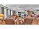 Bright living room featuring hardwood floors, fireplace, and ample seating at 6509 Oak Hammock Ct, Winter Haven, FL 33884