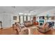 Comfortable living area with hardwood floors, fireplace and natural light at 6509 Oak Hammock Ct, Winter Haven, FL 33884