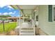 Cozy front porch with seating, perfect for relaxing outdoors at 6509 Oak Hammock Ct, Winter Haven, FL 33884