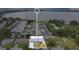 Community aerial view with homes, landscaping, lake and overlay to highlight property location at 686 22Nd Nw St, Winter Haven, FL 33880