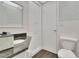Updated bathroom with sink vanity, granite countertop, and modern mosaic tile at 686 22Nd Nw St, Winter Haven, FL 33880