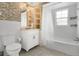 Updated bathroom boasts decorative tile accents, modern vanity, and shower-tub combination with updated tile at 686 22Nd Nw St, Winter Haven, FL 33880