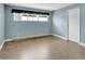 Light-blue painted bedroom with wood-look tile flooring and baseboard trim at 686 22Nd Nw St, Winter Haven, FL 33880