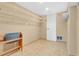 Spacious walk-in closet offering ample storage, shelving, and a neutral color scheme for easy organization at 686 22Nd Nw St, Winter Haven, FL 33880