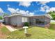 Charming home with a well-maintained lawn, screened-in pool area, and attractive landscaping at 686 22Nd Nw St, Winter Haven, FL 33880