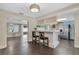 Eat-in kitchen featuring an open bar area, stainless steel appliances, and light blue cabinets at 686 22Nd Nw St, Winter Haven, FL 33880