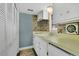 Compact kitchen with white cabinets, mosaic backsplash, and functional appliances, offering efficient meal preparation at 686 22Nd Nw St, Winter Haven, FL 33880