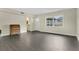 Bright living room with tiled floors, window, and access to a bathroom at 686 22Nd Nw St, Winter Haven, FL 33880