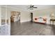 Open living room featuring wood floors, seamlessly connecting to the kitchen at 686 22Nd Nw St, Winter Haven, FL 33880
