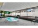 Relaxing enclosed pool area with an in-ground spa, patio, and privacy screen, perfect for outdoor enjoyment at 686 22Nd Nw St, Winter Haven, FL 33880