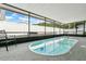 Enclosed pool with patio space and privacy screens, creating a tranquil outdoor retreat for relaxation and recreation at 686 22Nd Nw St, Winter Haven, FL 33880