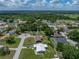 An aerial view shows the home, its lot and landscaping, and the neighborhood beyond at 7150 Orange Way, Lakeland, FL 33810