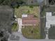 Aerial shot of entire property, highlighting its spacious lot with some landscaping at 7150 Orange Way, Lakeland, FL 33810