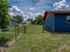 Backyard, featuring a fenced yard with lawn at 7150 Orange Way, Lakeland, FL 33810