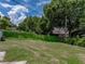 Expansive backyard with mature landscaping and privacy fence at 7150 Orange Way, Lakeland, FL 33810