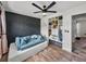 Modern bedroom with an accent wall and a white closet system at 7150 Orange Way, Lakeland, FL 33810