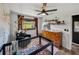 Bedroom featuring a crib, dresser, modern ceiling fan, and natural light at 7150 Orange Way, Lakeland, FL 33810