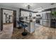 Bright kitchen featuring a breakfast bar and open doorway to a separate room at 7150 Orange Way, Lakeland, FL 33810