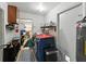 Bright laundry room with modern washer and dryer, storage, and convenient access to utilities at 7150 Orange Way, Lakeland, FL 33810