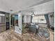 Inviting living room with a dining area and stainless steel refrigerator in view at 7150 Orange Way, Lakeland, FL 33810