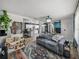 Bright living room showcasing the open floor plan with adjacent kitchen at 7150 Orange Way, Lakeland, FL 33810