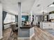 Open-concept living area with a kitchen, dining space, and breakfast bar at 7150 Orange Way, Lakeland, FL 33810