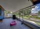 Enclosed patio featuring a backyard view, grill, and a kiddie pool at 7150 Orange Way, Lakeland, FL 33810