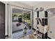 Sunroom with a cat tree and access to the screened outdoor area at 7150 Orange Way, Lakeland, FL 33810