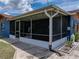 Covered and enclosed sunroom offers a cozy space for outdoor activities at 7150 Orange Way, Lakeland, FL 33810