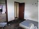 Bedroom with hardwood floors, an open closet and a dingy mattress at 745 Drawdy Rd, Babson Park, FL 33827