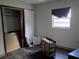 Bedroom with hardwood floors, natural light from a single window, and a closet at 745 Drawdy Rd, Babson Park, FL 33827