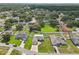 Aerial view of single Gathering home with a big backyard and mature trees in a quiet neighborhood at 8219 Rangers Path, Lakeland, FL 33809