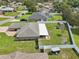 Spacious fenced backyard with a shed and covered patio offering plenty of room for outdoor activities at 8219 Rangers Path, Lakeland, FL 33809