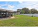 View of the spacious backyard with a storage shed in the background at 8219 Rangers Path, Lakeland, FL 33809
