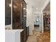 This spacious bathroom boasts a tiled floor, walk-in closet, walk-in shower, and dark wood cabinetry at 8219 Rangers Path, Lakeland, FL 33809