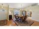 Inviting dining room boasts hardwood floors and an arched window with lots of natural light at 8219 Rangers Path, Lakeland, FL 33809