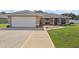 Inviting single-story home with a spacious two-car garage and attractive landscaping at 8219 Rangers Path, Lakeland, FL 33809
