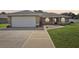 Charming single-story home featuring a two-car garage and well-maintained front yard at 8219 Rangers Path, Lakeland, FL 33809