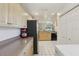 Bright kitchen features stainless steel appliances, white tile floors and lots of cabinet space at 8219 Rangers Path, Lakeland, FL 33809
