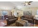 Inviting living area with hardwood floors, leather furniture, and an open layout at 8219 Rangers Path, Lakeland, FL 33809