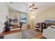 Bright office with window overlooking the water, ceiling fan, and hardwood floors at 8219 Rangers Path, Lakeland, FL 33809