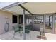 View of the covered patio with dining area, perfect for outdoor meals at 8219 Rangers Path, Lakeland, FL 33809